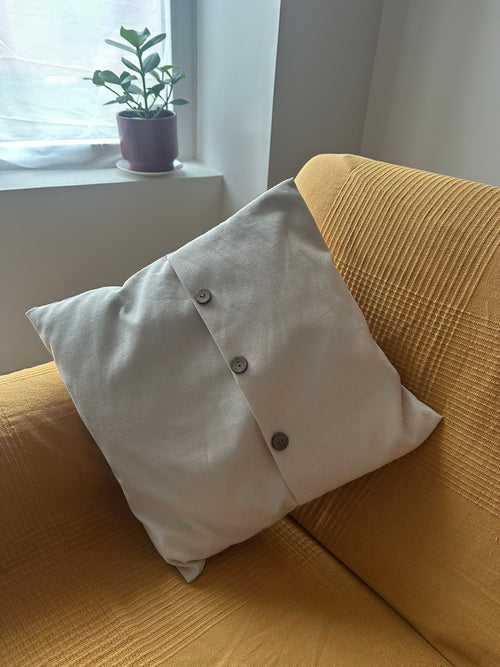 Trío de cojines artesanales en tonos naturales